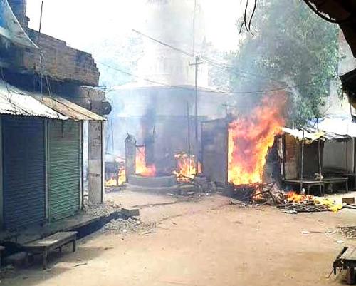 1.Shops belonging to Muslims that were set afire at Mahoba in Jhansi district of Uttar Pradesh on Sunday, 5 July 2015. (Photo: Dainik Bhaskar).